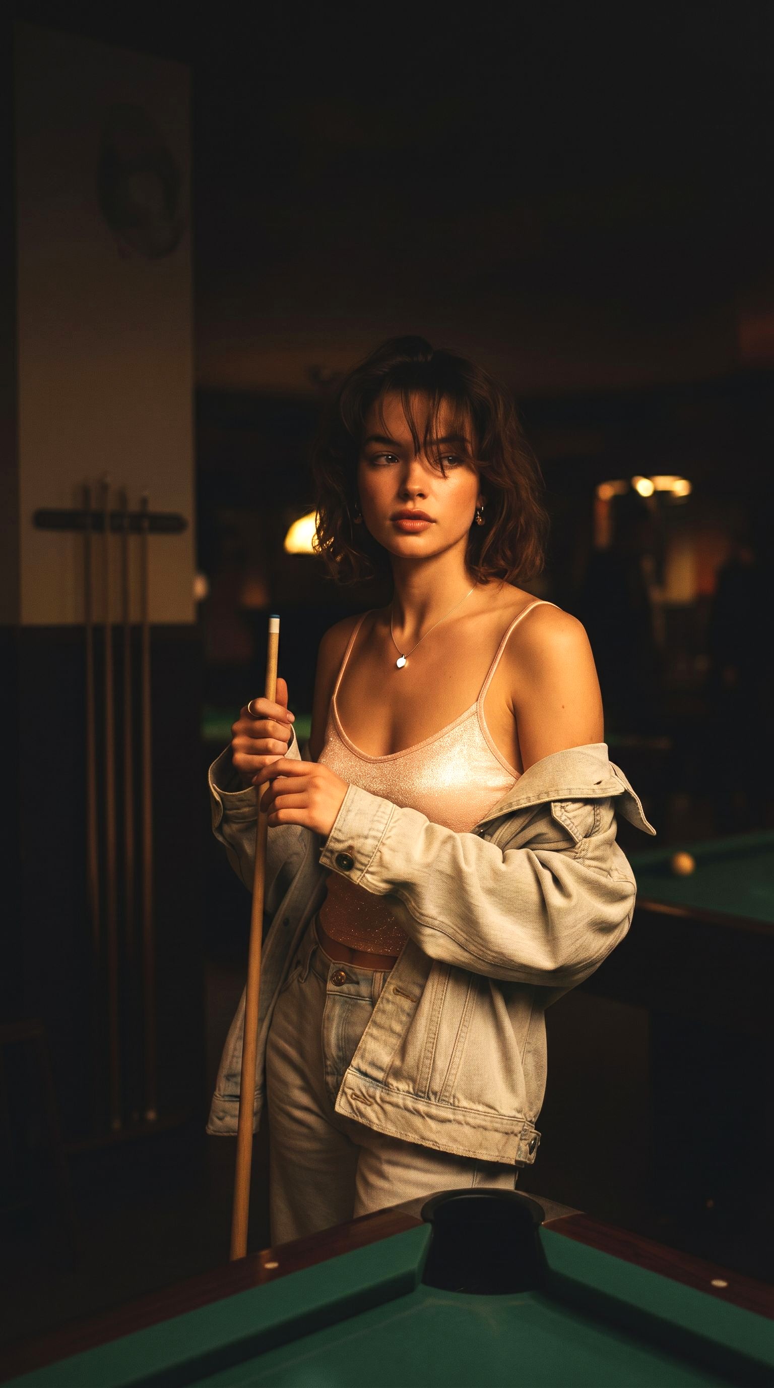 Louis Jacques self-illuminating sterling silver necklace worn by model holding cue in warm pool bar scene.