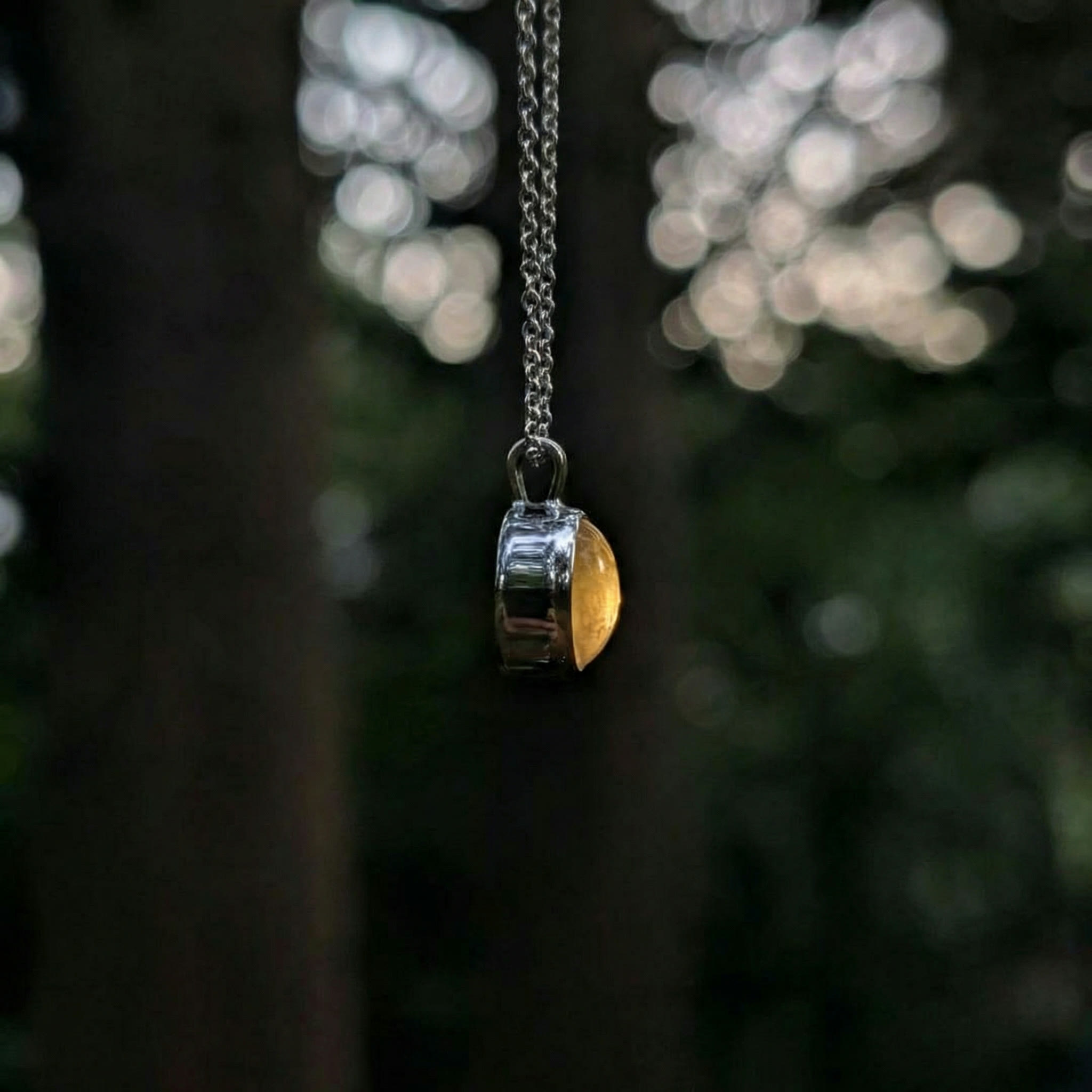 Louis Jacques pendant, profile view with warm glow